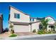 Stylish two-story home with a two-car garage and neutral exterior, complemented by well-maintained landscaping at 9476 Lunar Phase St, Las Vegas, NV 89143