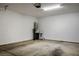 Clean, spacious garage with concrete flooring and installed water heater at 9476 Lunar Phase St, Las Vegas, NV 89143