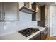 Modern kitchen with stainless steel appliances, white backsplash, and quartz countertops at 9476 Lunar Phase St, Las Vegas, NV 89143