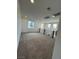 Upstairs carpeted loft area with natural light, and modern railing at 9476 Lunar Phase St, Las Vegas, NV 89143
