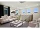Bright upstairs loft area with contemporary furnishings and modern railing at 9476 Lunar Phase St, Las Vegas, NV 89143