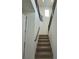 Carpeted staircase with modern railing design connects different levels of the house at 9476 Lunar Phase St, Las Vegas, NV 89143