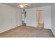Spacious bedroom with multiple doors and plush carpet offers lots of natural light at 950 Seven Hills Dr # 524, Henderson, NV 89052