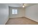 Bright bedroom features neutral carpet, a ceiling fan, and window allowing plenty of natural light at 950 Seven Hills Dr # 524, Henderson, NV 89052