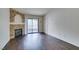 Bright living room features a stone fireplace, balcony access and ample natural light at 950 Seven Hills Dr # 524, Henderson, NV 89052