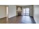 A bright living room with wood floors, a fireplace, and sliding door to a patio at 950 Seven Hills Dr # 524, Henderson, NV 89052