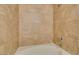 Tiled shower and tub combination features updated fixtures at 950 Seven Hills Dr # 524, Henderson, NV 89052