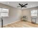 Bedroom boasts natural light, modern ceiling fan, and wood flooring at 1017 E Oakey Blvd, Las Vegas, NV 89104