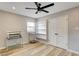 Bedroom boasts natural light, modern ceiling fan, and wood flooring at 1017 E Oakey Blvd, Las Vegas, NV 89104