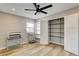 Bedroom boasts natural light, modern ceiling fan, and wood flooring at 1017 E Oakey Blvd, Las Vegas, NV 89104
