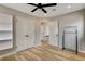 Bedroom boasts natural light, modern ceiling fan, and wood flooring at 1017 E Oakey Blvd, Las Vegas, NV 89104