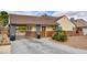 Charming single-story home featuring a gated driveway and neatly landscaped front yard at 1017 E Oakey Blvd, Las Vegas, NV 89104