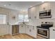 Modern kitchen with white cabinetry, stainless steel appliances, and subway tile backsplash at 1017 E Oakey Blvd, Las Vegas, NV 89104