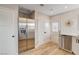 Modern kitchen with stainless steel refrigerator and dishwasher, white cabinets, and tiled backsplash at 1017 E Oakey Blvd, Las Vegas, NV 89104