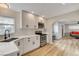 Updated kitchen features white cabinets, stainless steel appliances, and a modern sink at 1017 E Oakey Blvd, Las Vegas, NV 89104