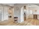 Open-concept space showcasing hardwood floors connecting the living area to the kitchen and bedroom at 1017 E Oakey Blvd, Las Vegas, NV 89104