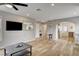 Living room featuring hardwood floors, modern lighting, and an open layout into the kitchen at 1017 E Oakey Blvd, Las Vegas, NV 89104