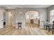 Open-concept living room with hardwood floors, an arched doorway, and a modern color scheme at 1017 E Oakey Blvd, Las Vegas, NV 89104