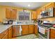 Well-equipped kitchen with stainless steel appliances, granite countertops, and modern finishes at 10203 Arlington Abby St, Las Vegas, NV 89183