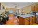 Open concept kitchen with stainless steel appliances and a dining area beyond at 10203 Arlington Abby St, Las Vegas, NV 89183