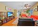 Inviting living room featuring hardwood floors, comfortable seating, and decorative wall art at 10203 Arlington Abby St, Las Vegas, NV 89183