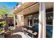 Charming covered patio with a beautiful water fountain and outdoor seating area at 10370 Sweet Laurel St, Las Vegas, NV 89178