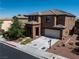 Charming two-story home with a two car garage, desert landscaping, and covered entry way at 10373 Northern Hills Ave, Las Vegas, NV 89166