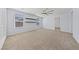 Bright loft with carpet floors, large windows, and a ceiling fan at 10373 Northern Hills Ave, Las Vegas, NV 89166