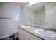 Bright bathroom boasts a dual sink vanity, vinyl flooring, and a shower/tub combo at 1136 Paradise Garden Dr, Henderson, NV 89002