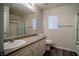 Functional bathroom with a laminate countertop, window, and shower-tub combo at 1136 Paradise Garden Dr, Henderson, NV 89002