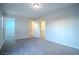 This cozy bedroom features neutral paint, soft carpet and an ensuite bathroom at 1136 Paradise Garden Dr, Henderson, NV 89002