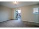 This bright bedroom features sliding glass doors that lead to an outdoor balcony at 1136 Paradise Garden Dr, Henderson, NV 89002
