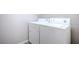 Bright laundry room features a full-size washer and dryer for added convenience at 1136 Paradise Garden Dr, Henderson, NV 89002