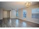 Open-concept living room features sleek modern flooring, bright windows, stylish lighting and neutral wall paint at 1136 Paradise Garden Dr, Henderson, NV 89002