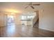 Bright living space flows into the kitchen, complemented by modern floors, fixtures, and stairs to the second floor at 1136 Paradise Garden Dr, Henderson, NV 89002