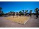 The community playground, featuring swings and a wood chip surface, provides a safe and fun environment for children at 1136 Paradise Garden Dr, Henderson, NV 89002