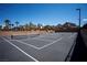 The community tennis and basketball court, is surrounded by palm trees, and scenic views at 1136 Paradise Garden Dr, Henderson, NV 89002