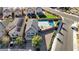 Aerial view of the home, showcasing the roof, landscaping, and nearby street at 1317 Hopespring Loop Ave, North Las Vegas, NV 89084