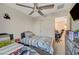 Comfortable bedroom featuring two twin beds, a ceiling fan, and neutral wall paint at 1317 Hopespring Loop Ave, North Las Vegas, NV 89084
