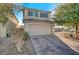 Charming two-story home with a quaint front yard and a two-car garage at 1317 Hopespring Loop Ave, North Las Vegas, NV 89084