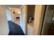Hallway with a laundry unit and view of the kitchen at 1701 E Katie Ave # 91, Las Vegas, NV 89119