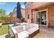 Backyard patio area with ample seating and a dining table, perfect for outdoor entertaining at 174 Augusta Course Ave, Las Vegas, NV 89148