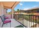 Charming balcony with seating area, offering serene views of the surrounding neighborhood and lush greenery at 174 Augusta Course Ave, Las Vegas, NV 89148