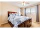 Cozy bedroom features a large bed with a blue and white patterned comforter, with side tables and lamps at 174 Augusta Course Ave, Las Vegas, NV 89148