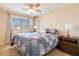 Relaxing bedroom with a comfortable queen-size bed, neutral walls, and window with a neighborhood view at 174 Augusta Course Ave, Las Vegas, NV 89148