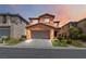Charming two-story home with a two-car garage, desert landscaping, and welcoming curb appeal at 174 Augusta Course Ave, Las Vegas, NV 89148