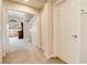 Upstairs hallway featuring bright natural light and a glimpse into a bedroom with a balcony at 174 Augusta Course Ave, Las Vegas, NV 89148