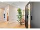 Upstairs hallway with a faux bamboo plant, built in lighting, and a large mirror at 174 Augusta Course Ave, Las Vegas, NV 89148
