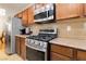 Modern kitchen featuring stainless steel appliances, gas range and granite countertops at 174 Augusta Course Ave, Las Vegas, NV 89148
