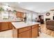 Spacious kitchen with island, granite countertops and access to dining areas at 174 Augusta Course Ave, Las Vegas, NV 89148